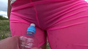 Lesbian with gorgeous booty in wet panties has fun with a girlfriend in nature and a bottle fuck a very overgrown cunt.